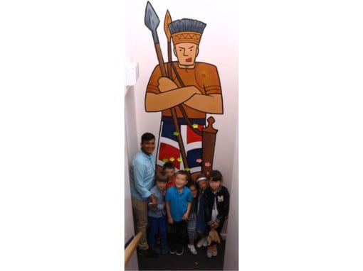 Goliath mural with kids